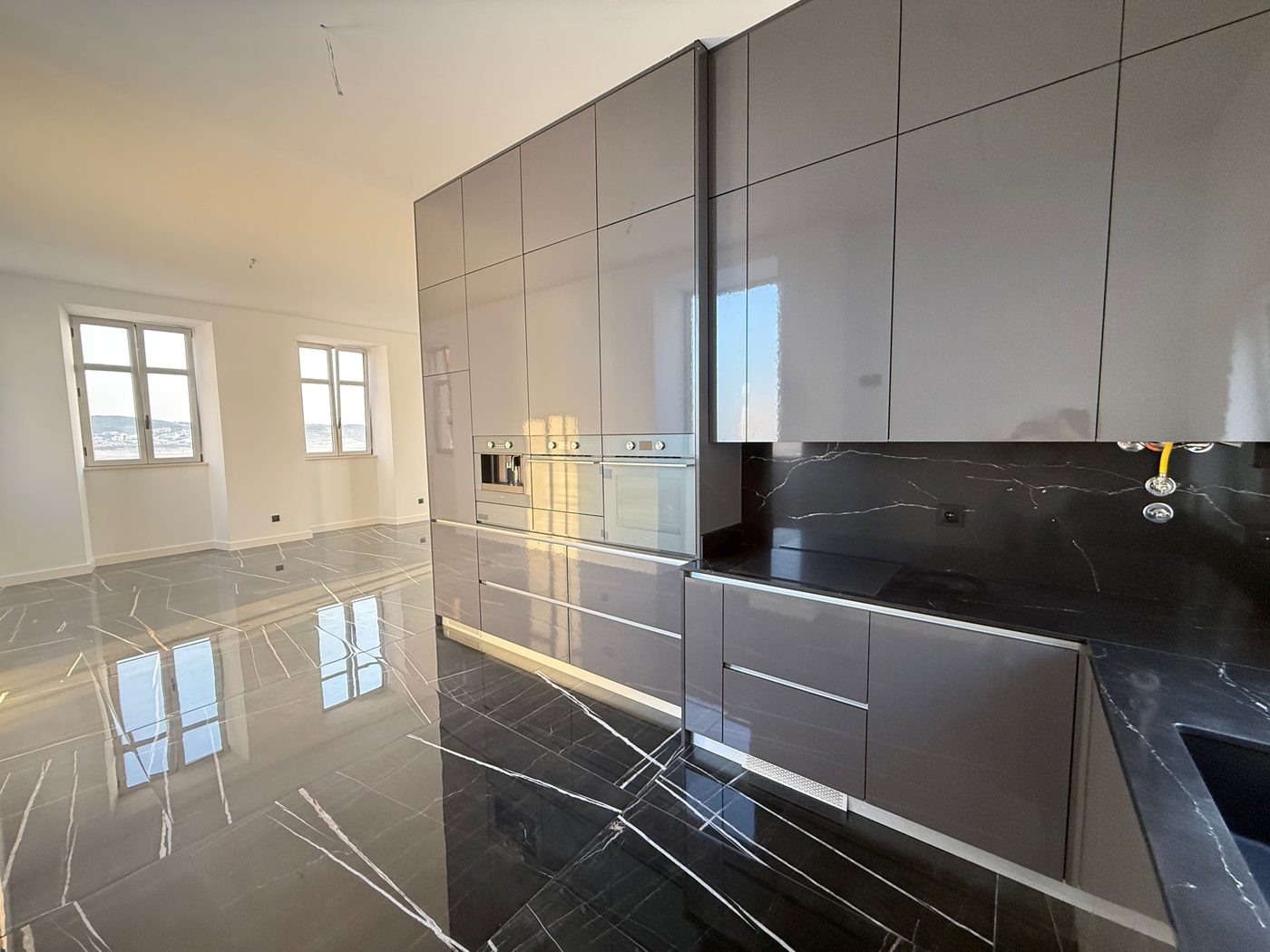 Open-plan kitchen, opening onto the living room